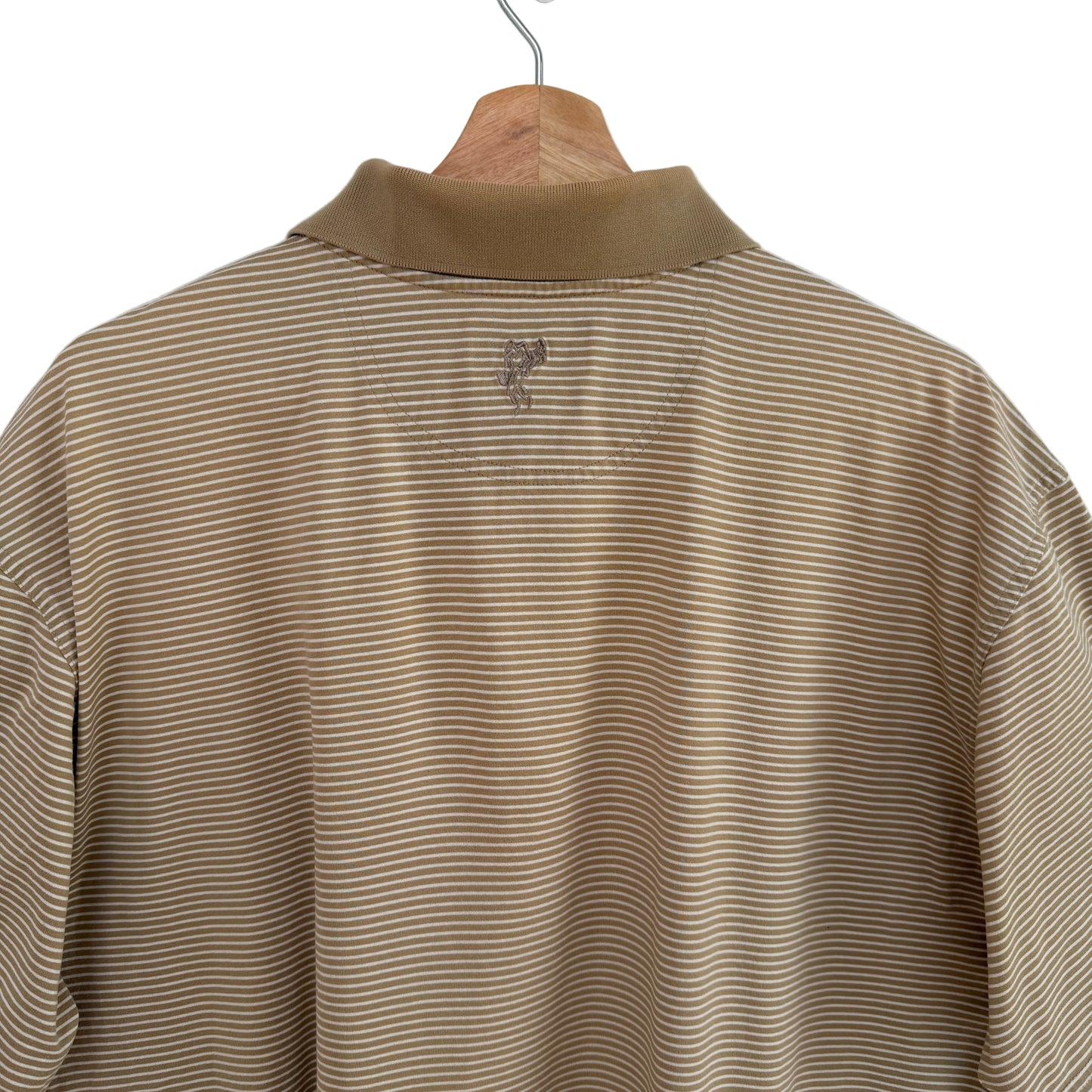 Brown striped shirt on a hanger against a white background