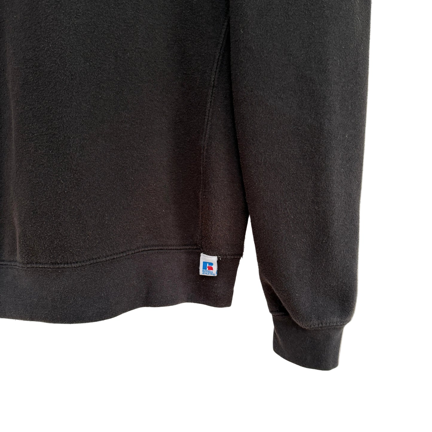 Black sweatshirt with a brand logo on the sleeve against a white background