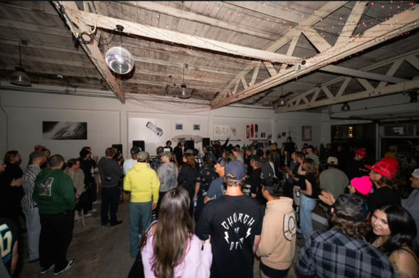 This is mnml golf club hosting an evening event, with a large gathering for a skate movie premier.