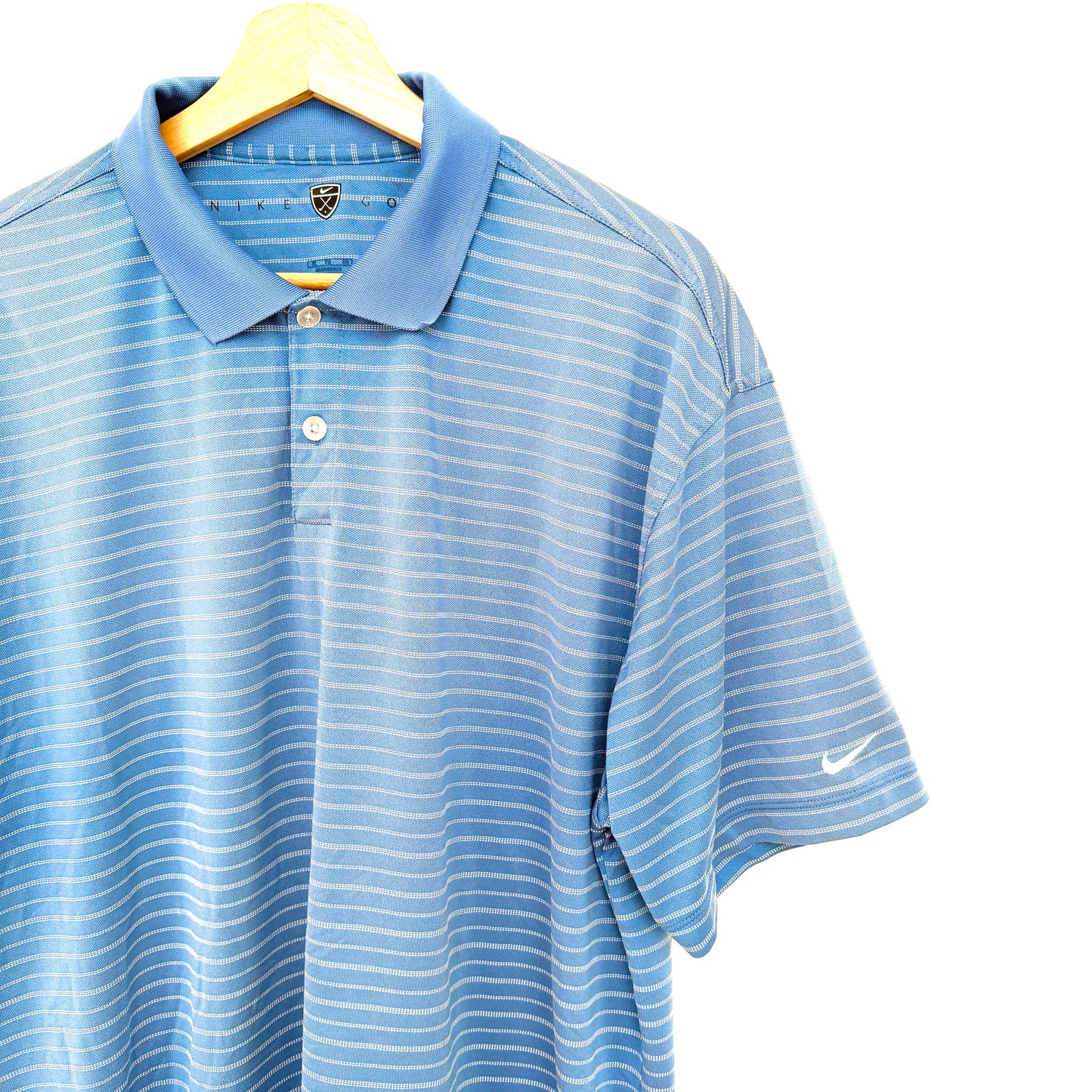 Blue striped polo shirt on a hanger against a white background