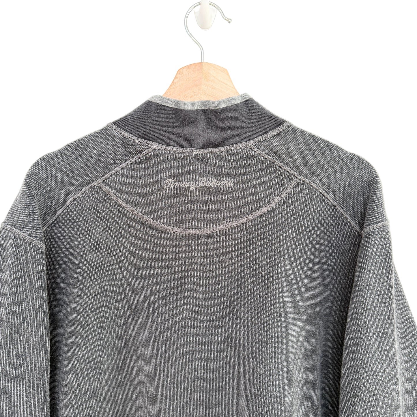 Gray fleece pullover on a hanger with 'Tommy Bahama' branding.