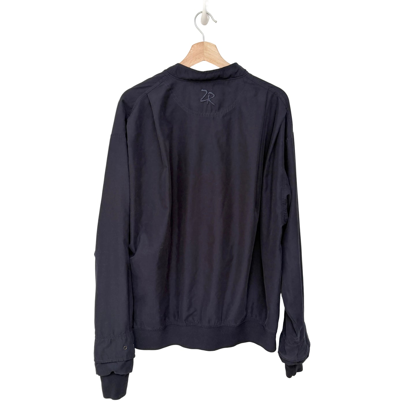 Navy blue long-sleeve shirt on a hanger against a white background