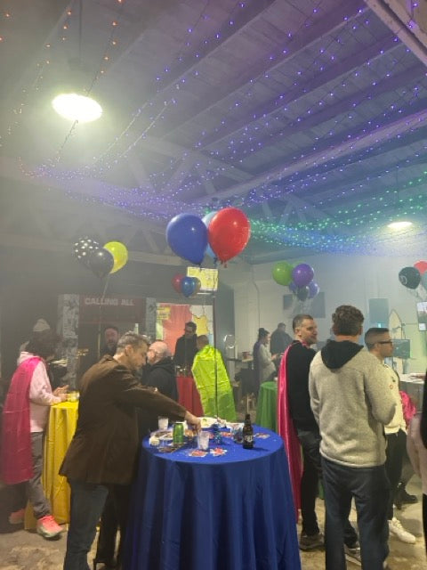This is mnml golf club's event space featuring party tables, balloons and costumes.