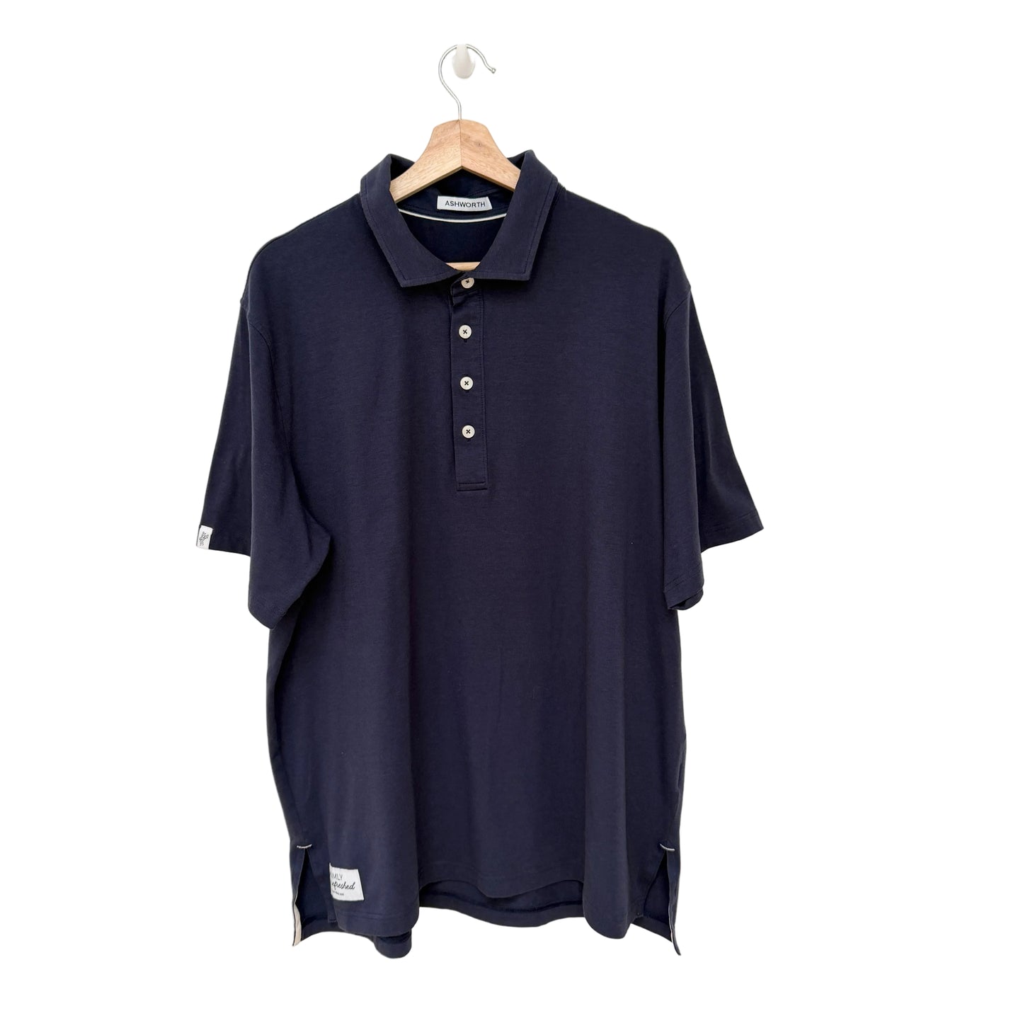 Navy blue polo shirt on a hanger against a white background