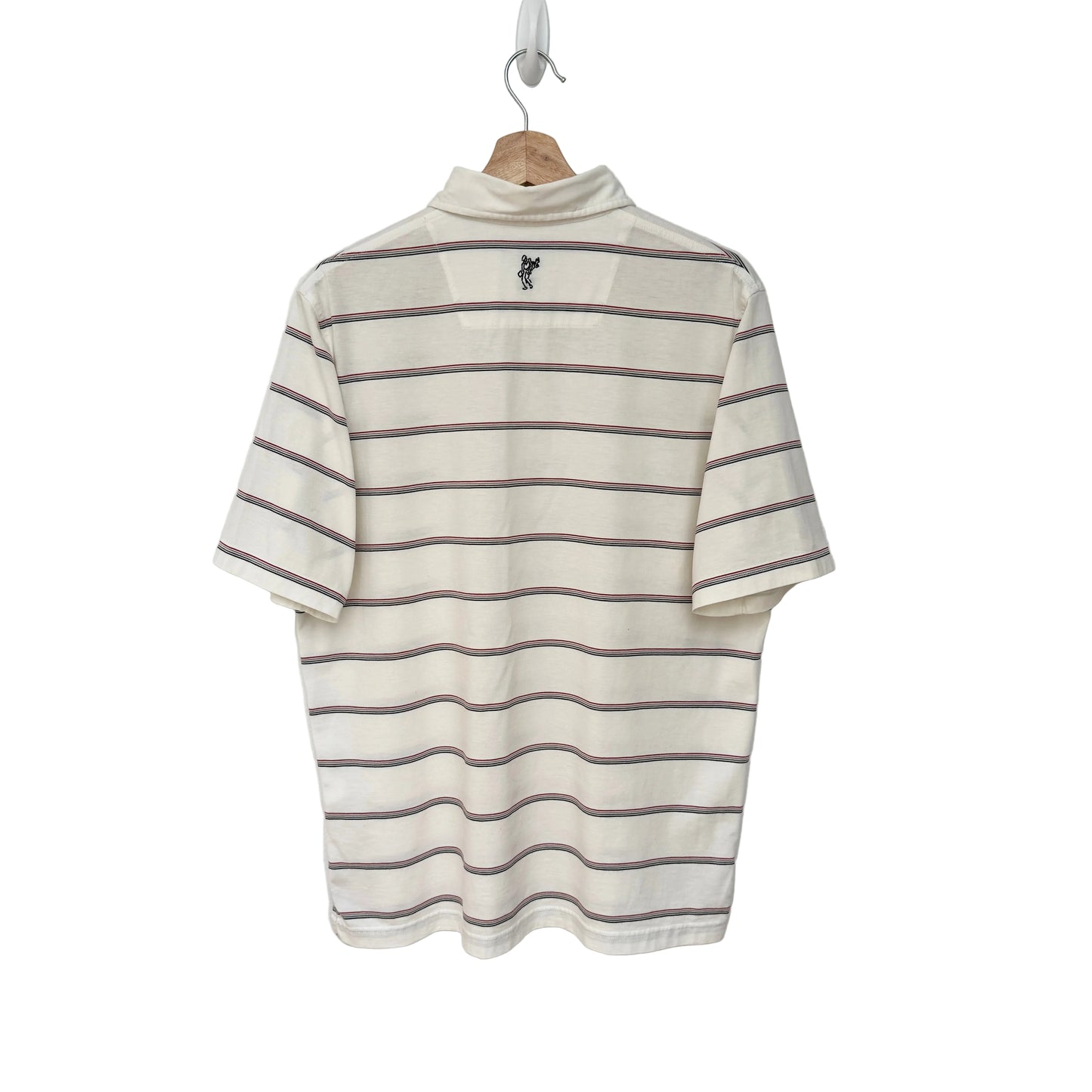 Striped shirt on a hanger against a plain background