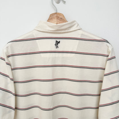Striped shirt with a small logo on a wooden hanger against a white background