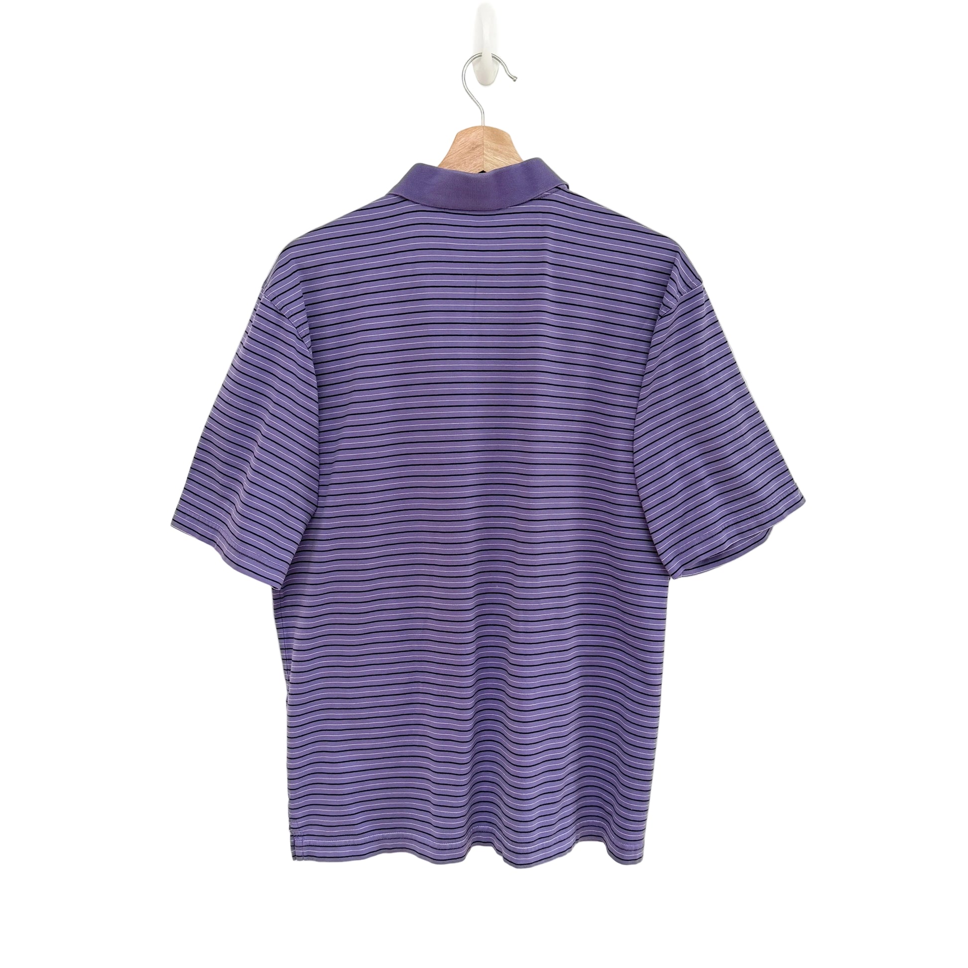 Purple striped shirt on a hanger against a white background