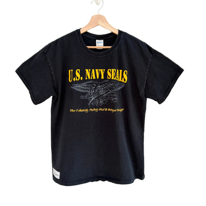 Black t-shirt with U.S. Navy SEALs logo on a hanger against a white background