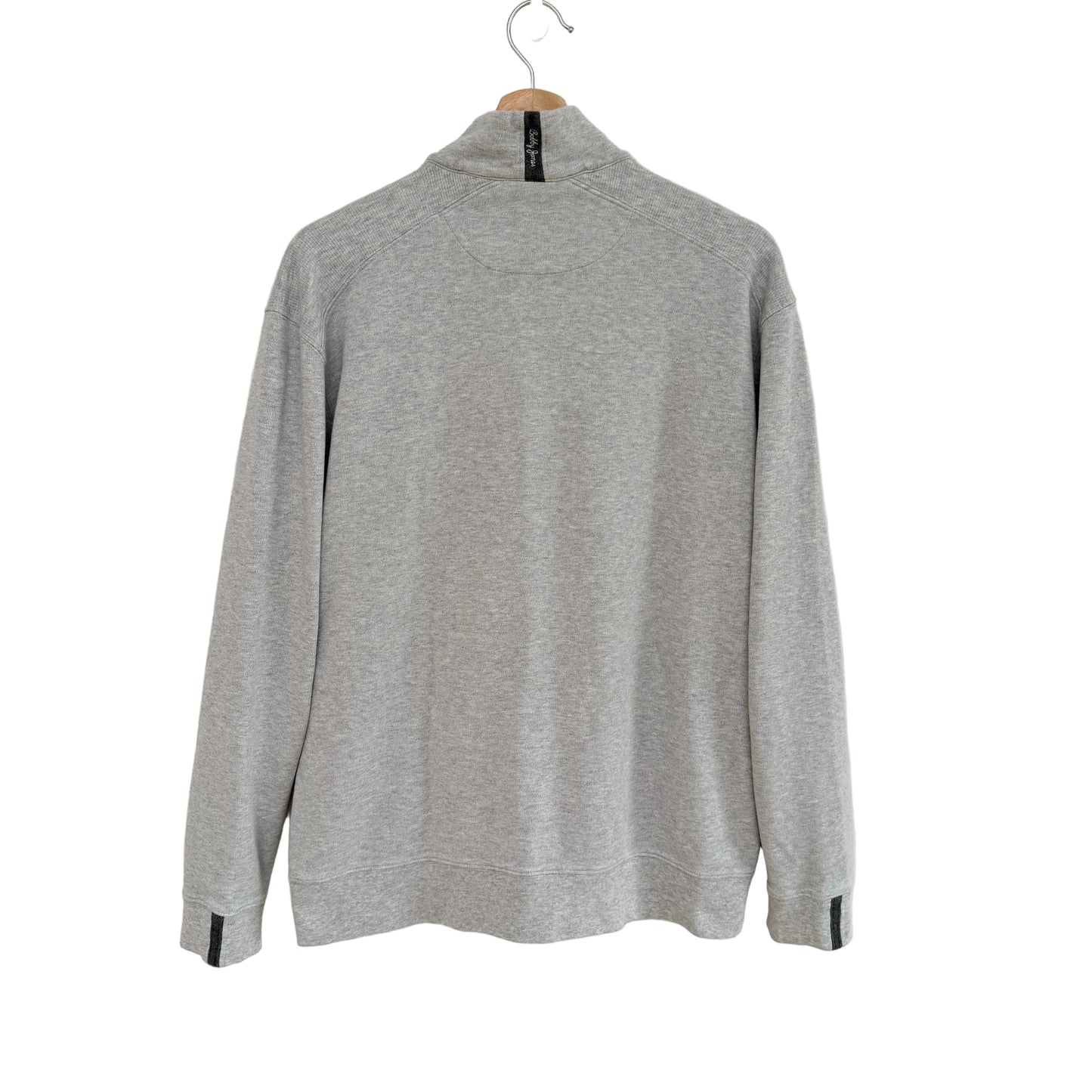 Gray sweater on a hanger against a white background