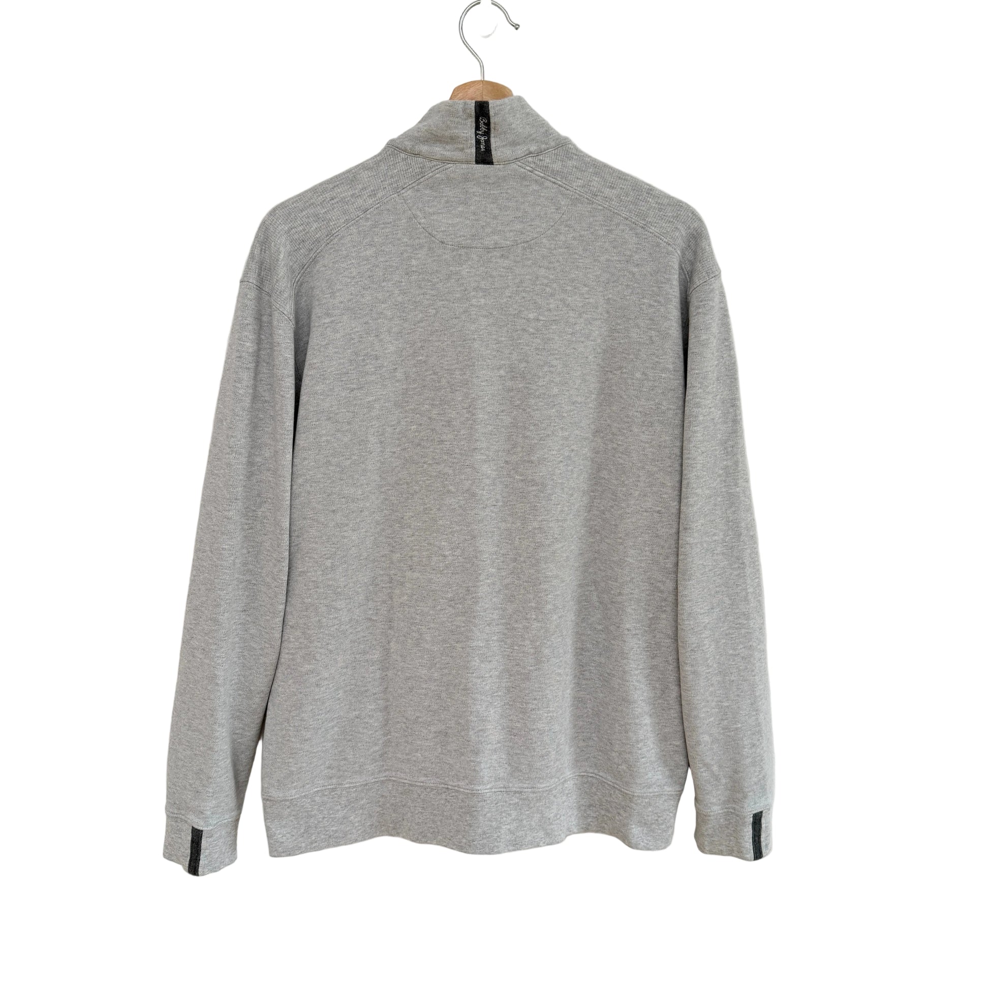 Gray sweater on a hanger against a white background