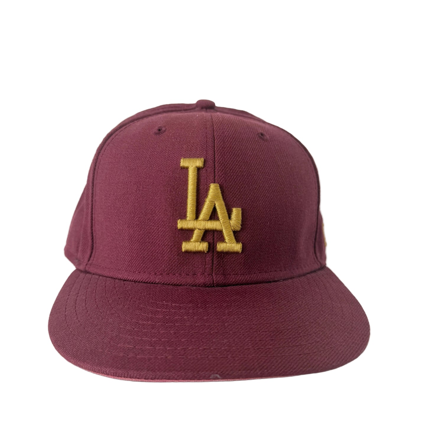 Maroon cap with gold 'LA' logo on a white background
