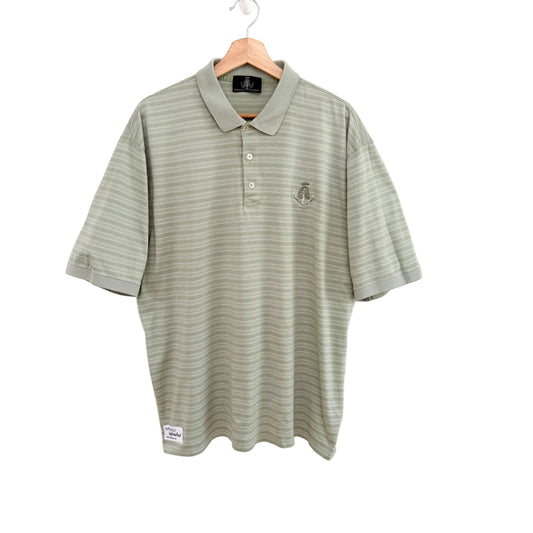 Green striped polo shirt on a hanger against a white background