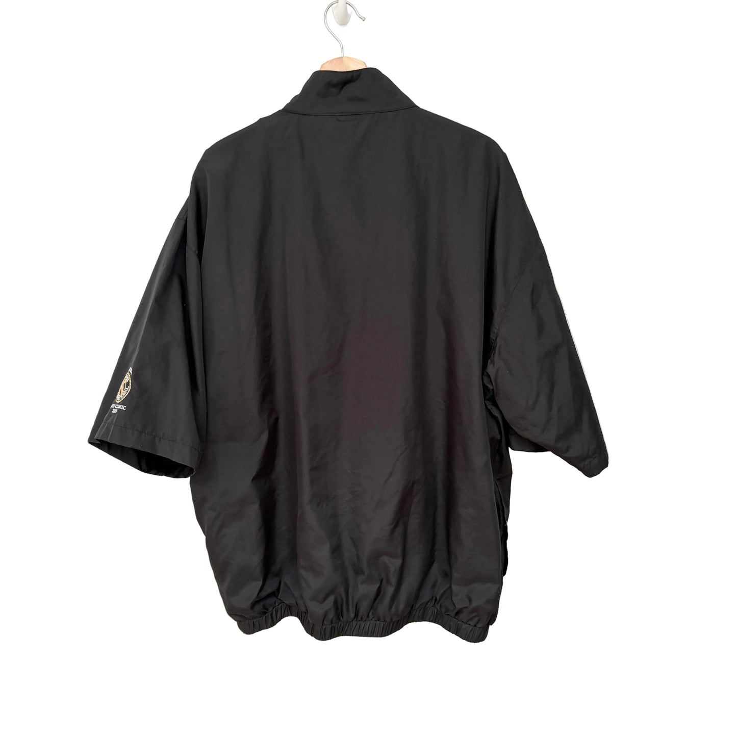 Black jacket on a hanger against a white background