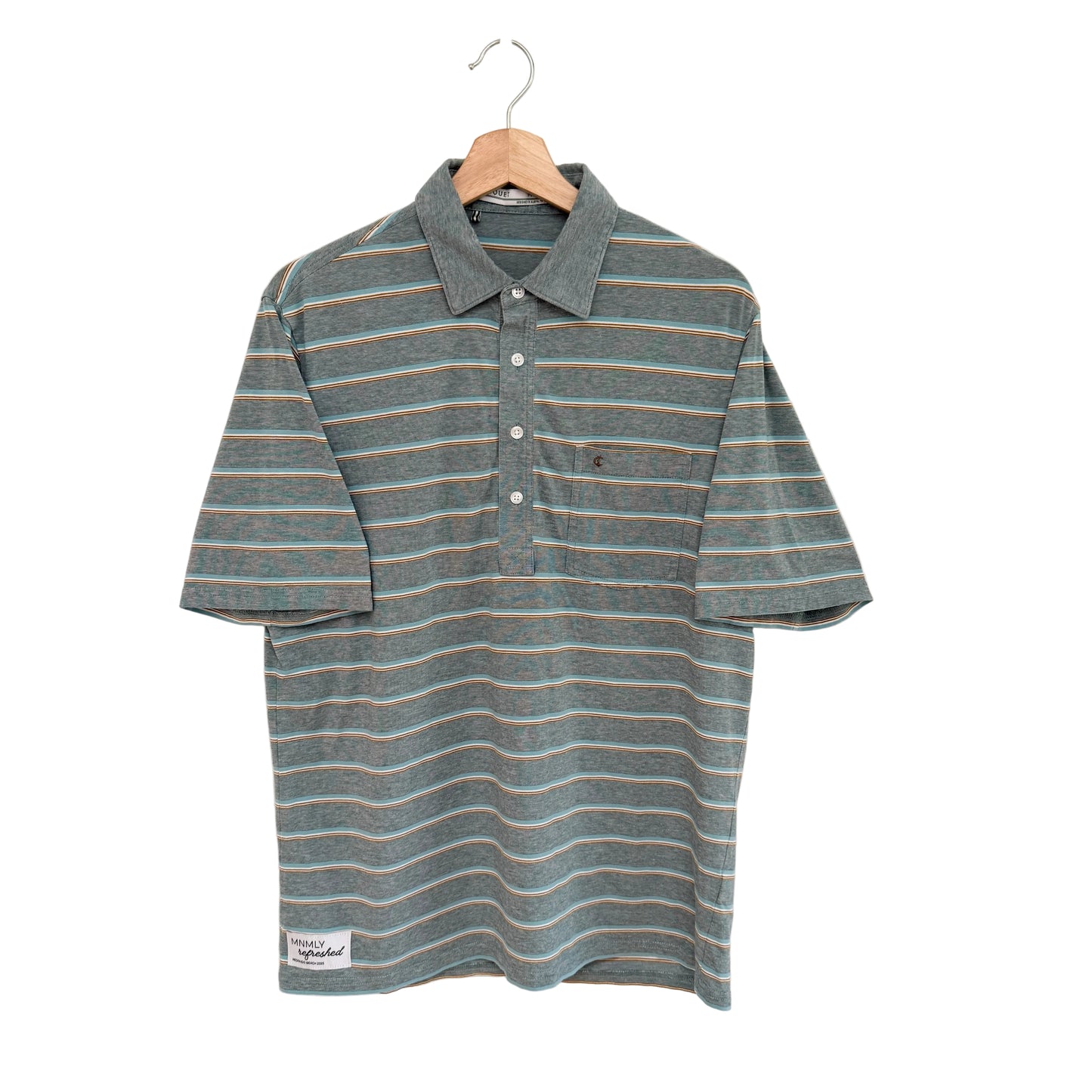 Striped shirt on a hanger against a white background