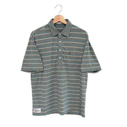 Striped shirt on a hanger against a white background