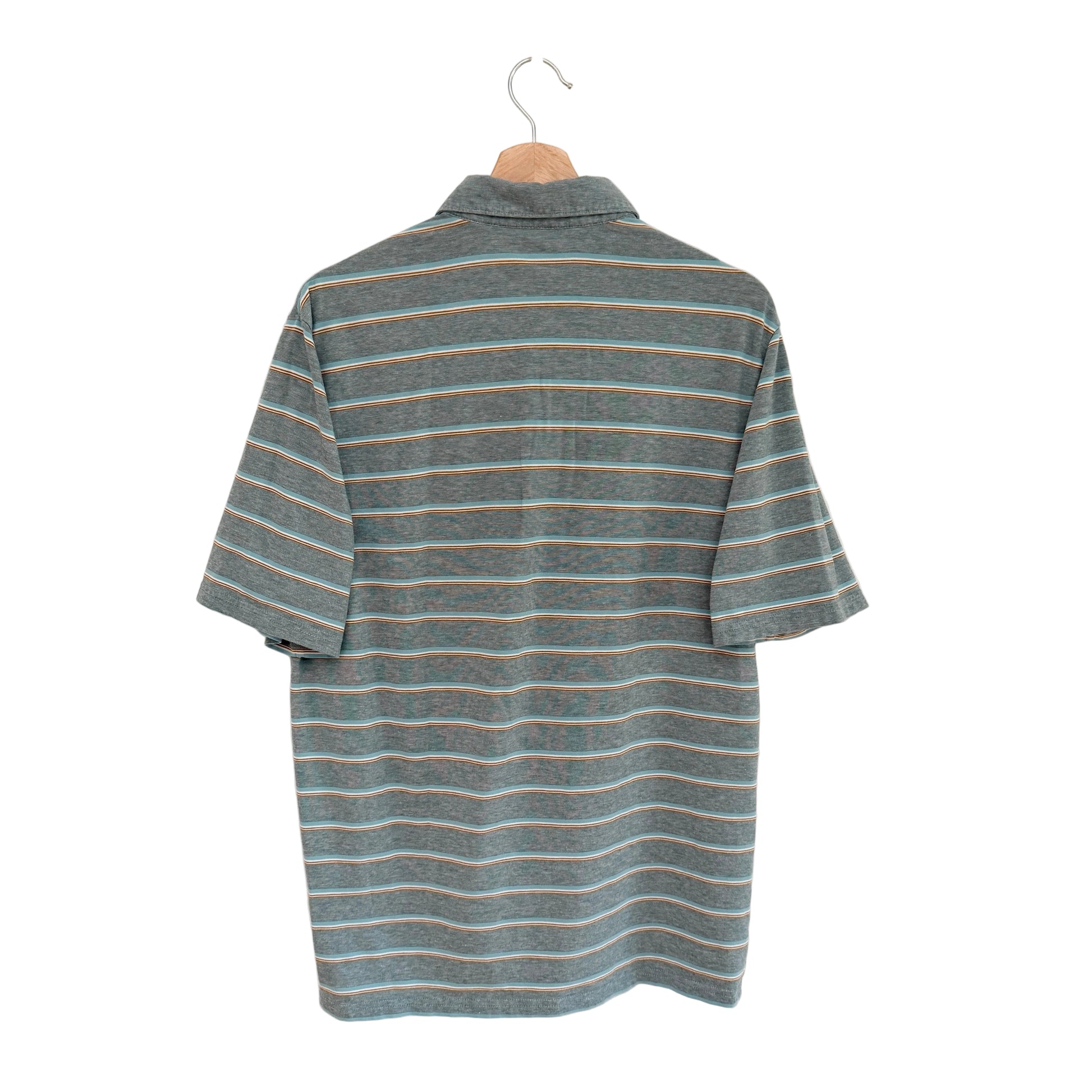 Striped shirt on a hanger against a white background