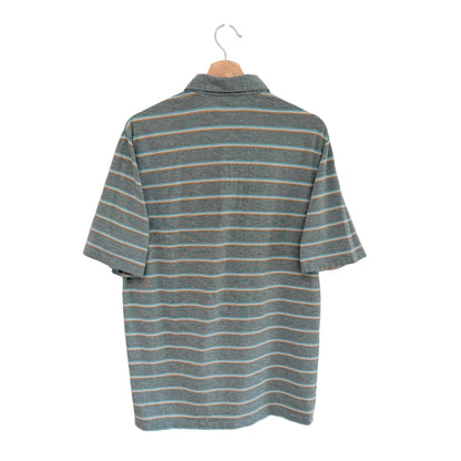 Striped shirt on a hanger against a white background