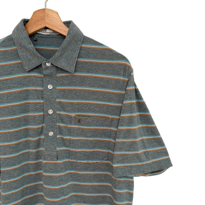 Striped polo shirt on a wooden hanger against a plain background