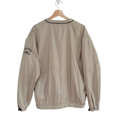 Beige jacket on a hanger against a white background