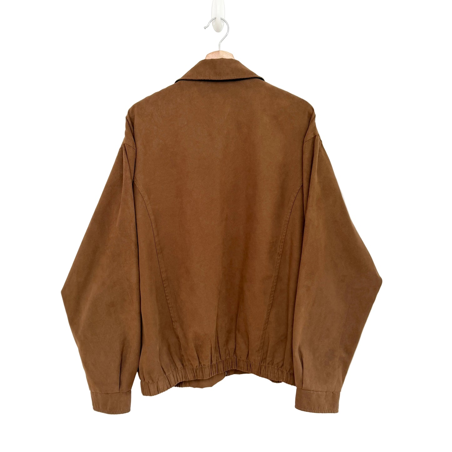 Brown jacket on a hanger against a white background