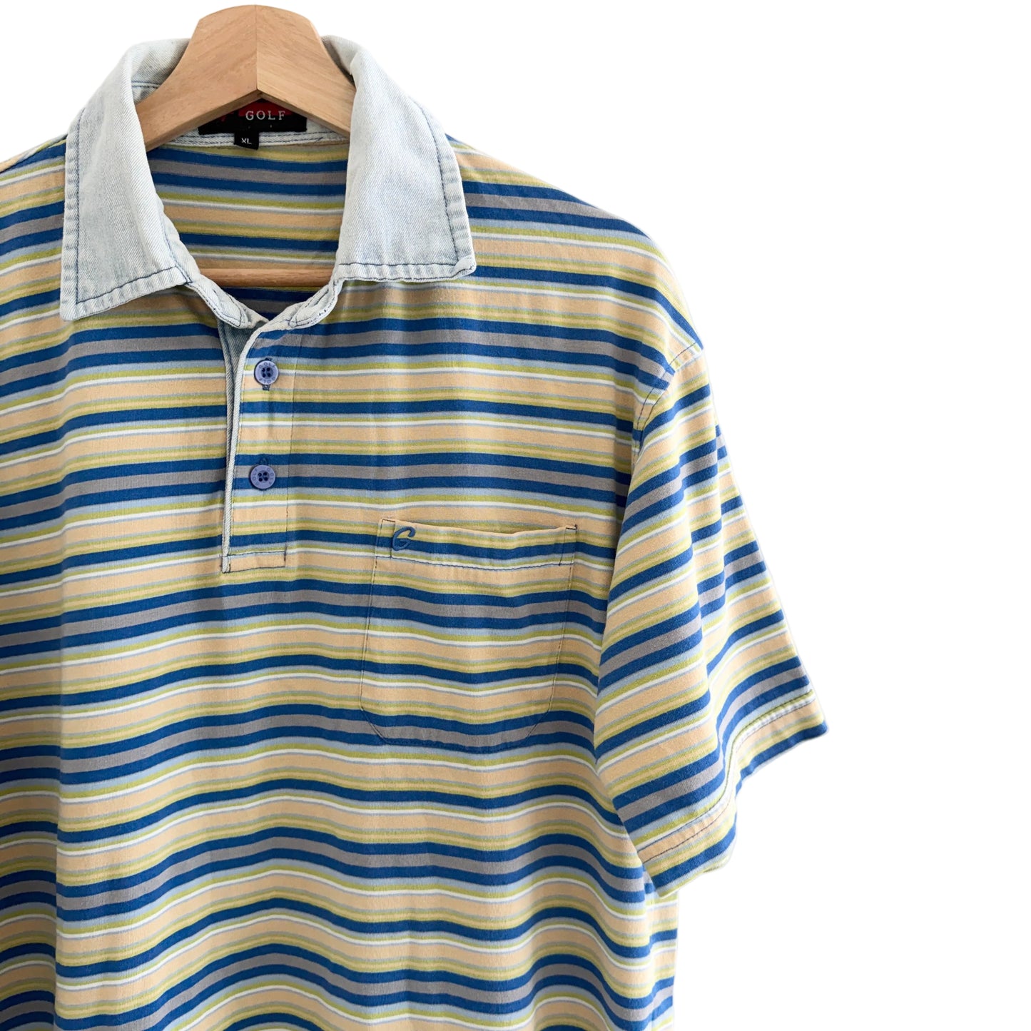 Striped polo shirt on a hanger with a white background