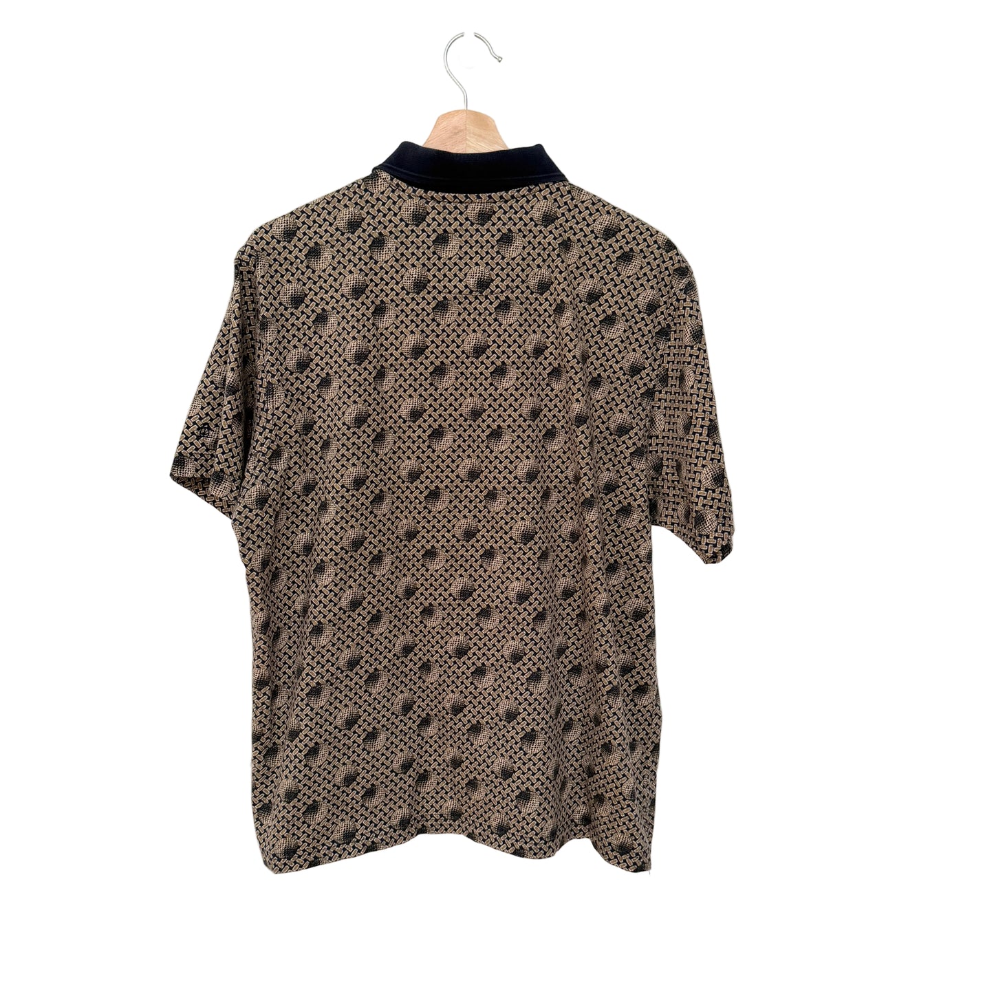 Patterned shirt on a hanger against a white background