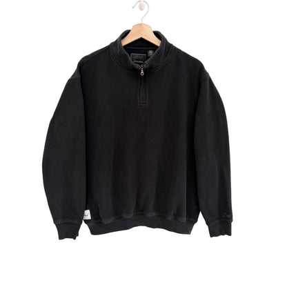 Black sweatshirt on a hanger against a white background