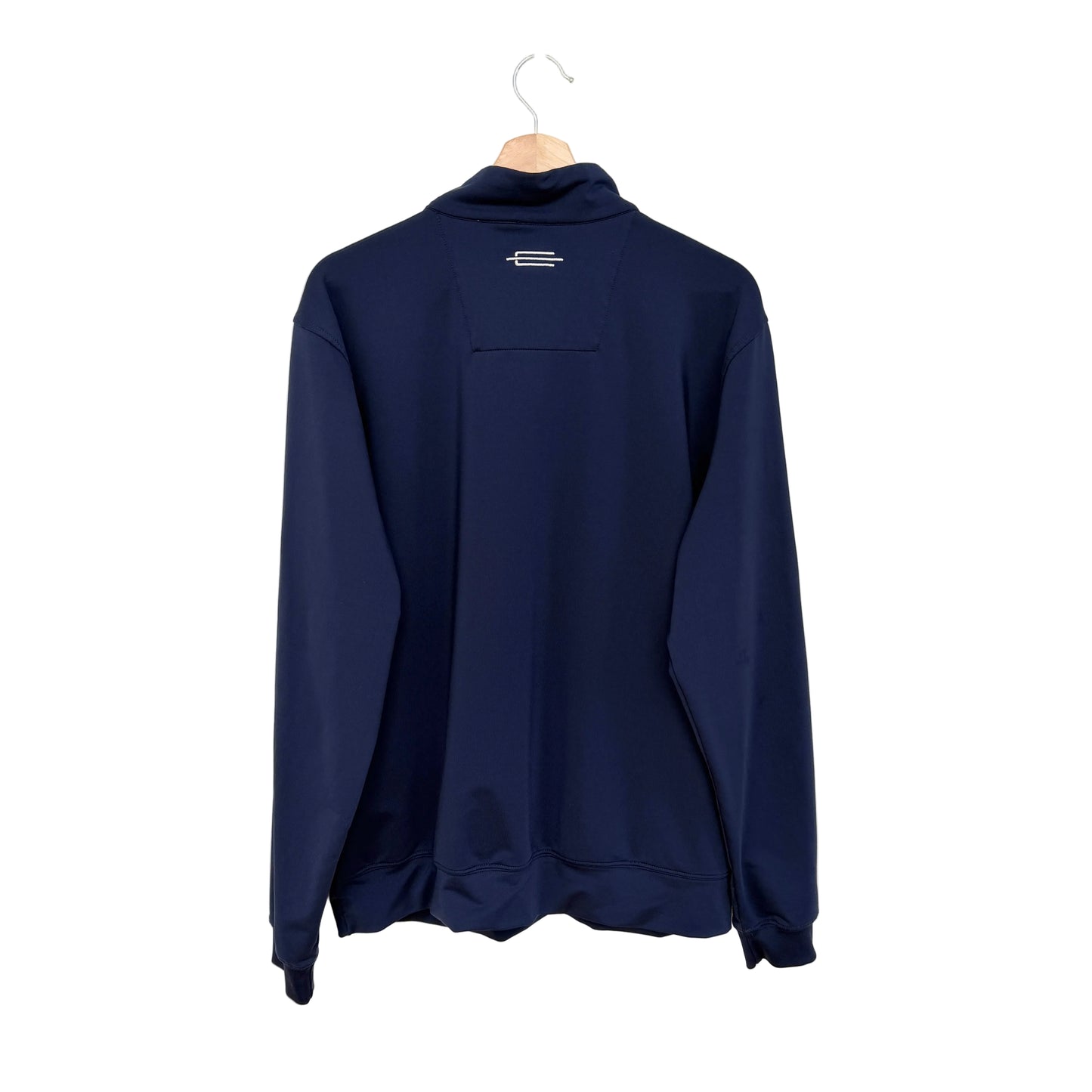 A navy blue long-sleeve quarter-zip pullover jacket hanging on a wooden hanger against a plain white wall.