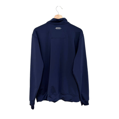 A navy blue long-sleeve quarter-zip pullover jacket hanging on a wooden hanger against a plain white wall.