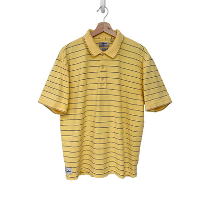 A yellow short-sleeve polo shirt with thin black horizontal stripes, hanging on a wooden hanger against a plain light gray wall.