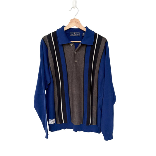 Blue sweater with striped pattern on a hanger against a white background