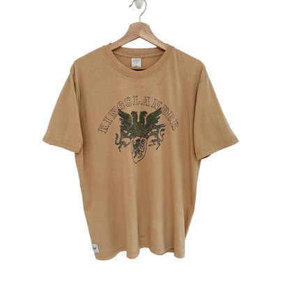 Beige t-shirt with 'Kingslander' graphic on a hanger against a white background