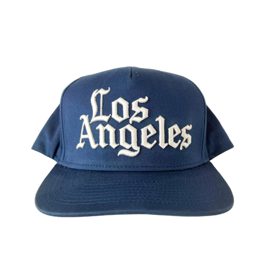 Blue cap with 'Los Angeles' text on a white background