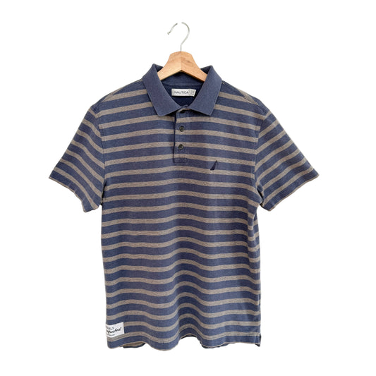 Blue and beige striped polo shirt on a hanger against a white background