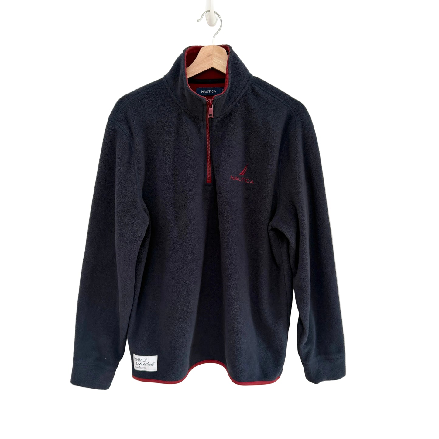 Navy fleece pullover with red interior on a white background