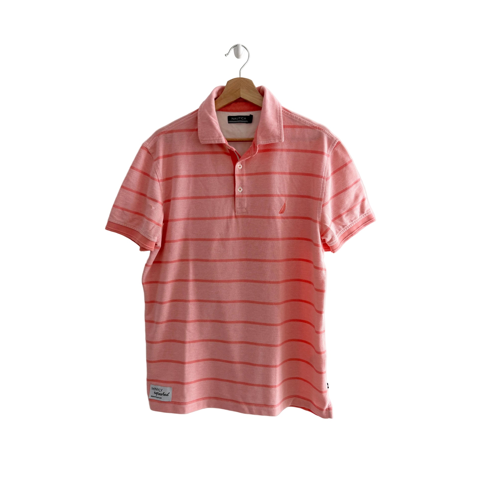 Pink striped polo shirt on a hanger against a white background
