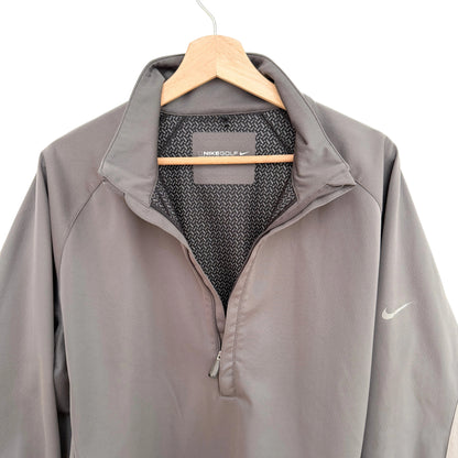 Gray Nike jacket on a hanger with a white background