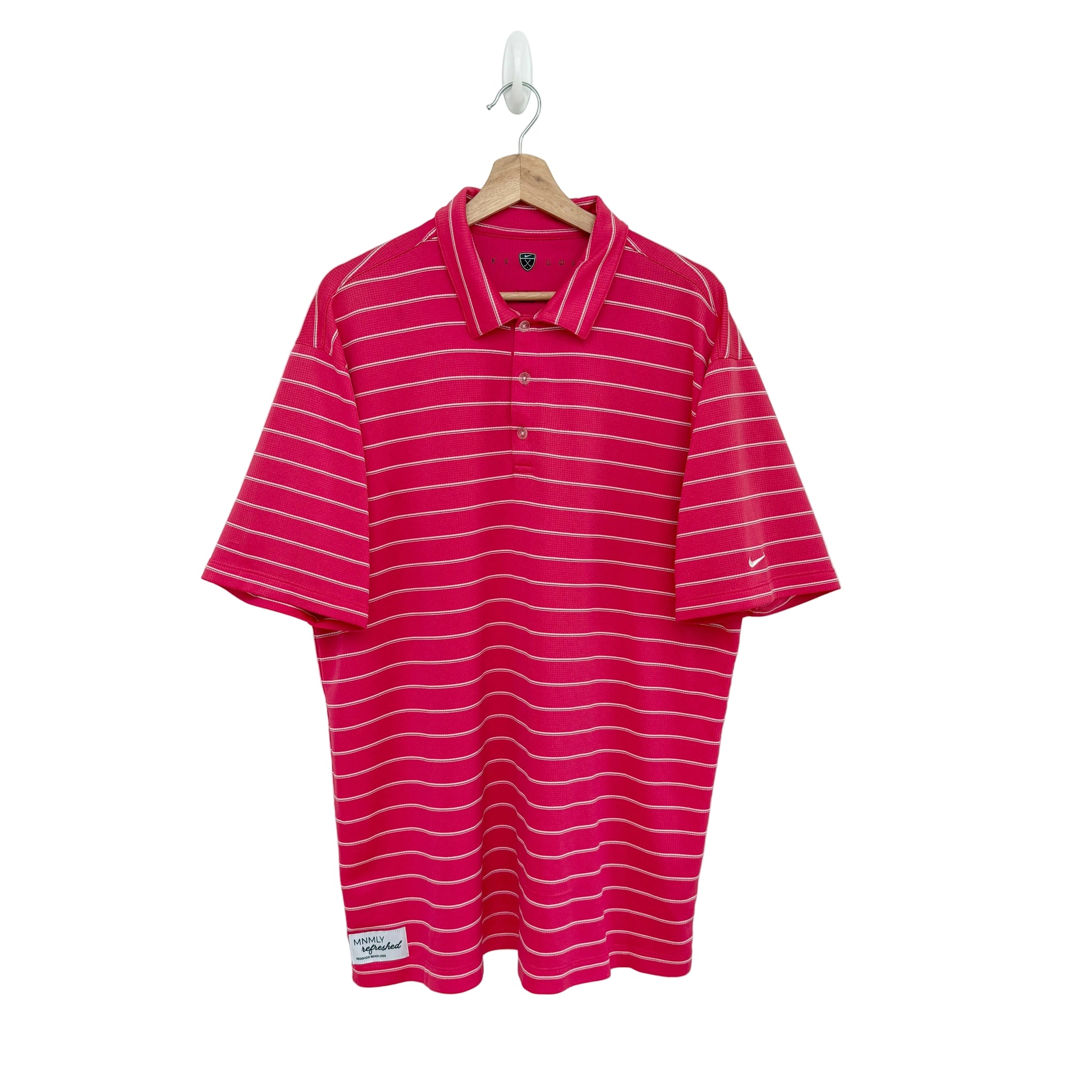 Pink striped polo shirt on a hanger against a white background
