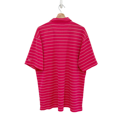 Pink and white striped polo shirt on a hanger against a white background