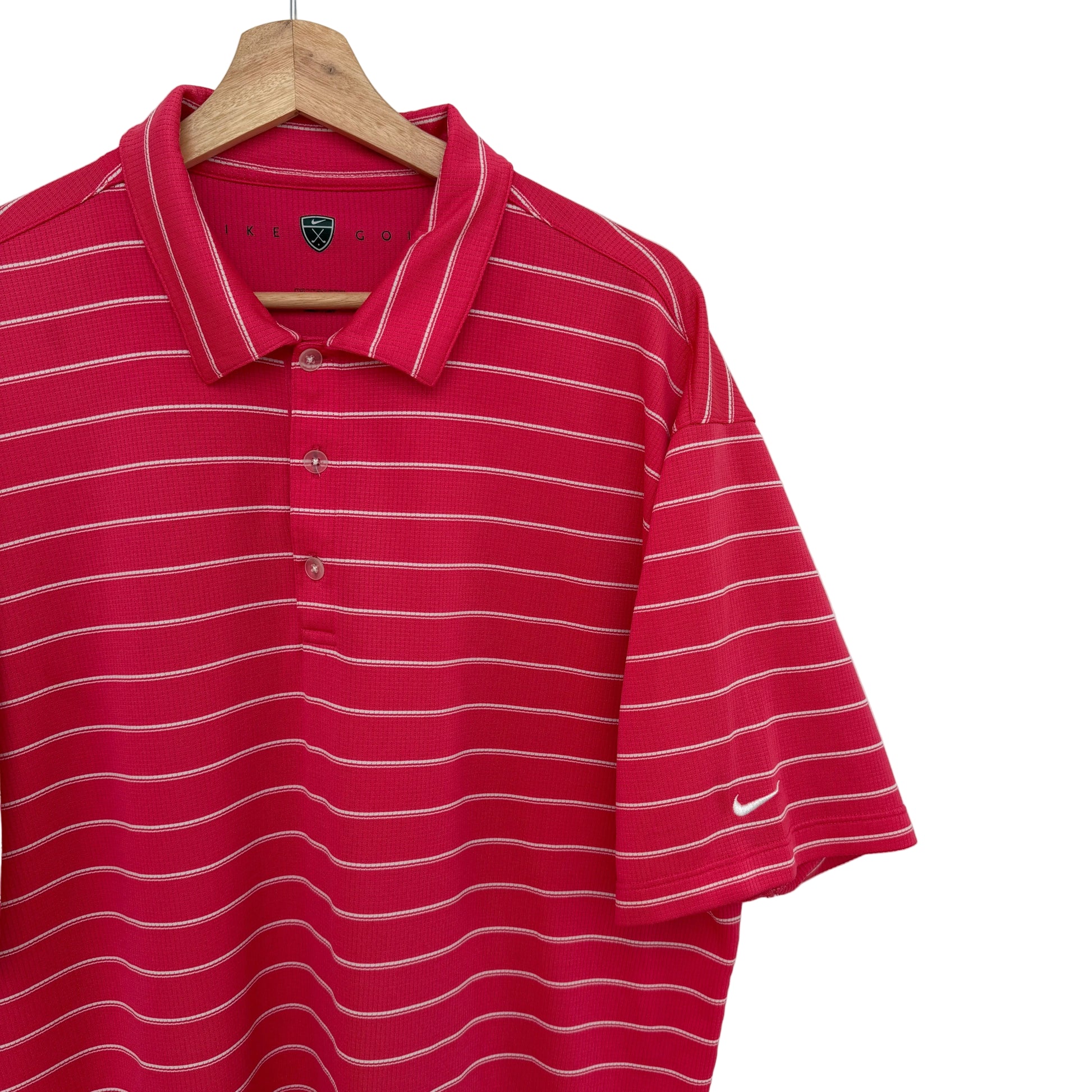 Pink striped polo shirt on a hanger against a white background