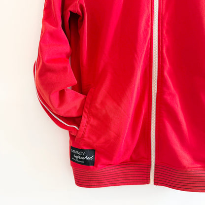 Red jacket with a visible brand label on a white background