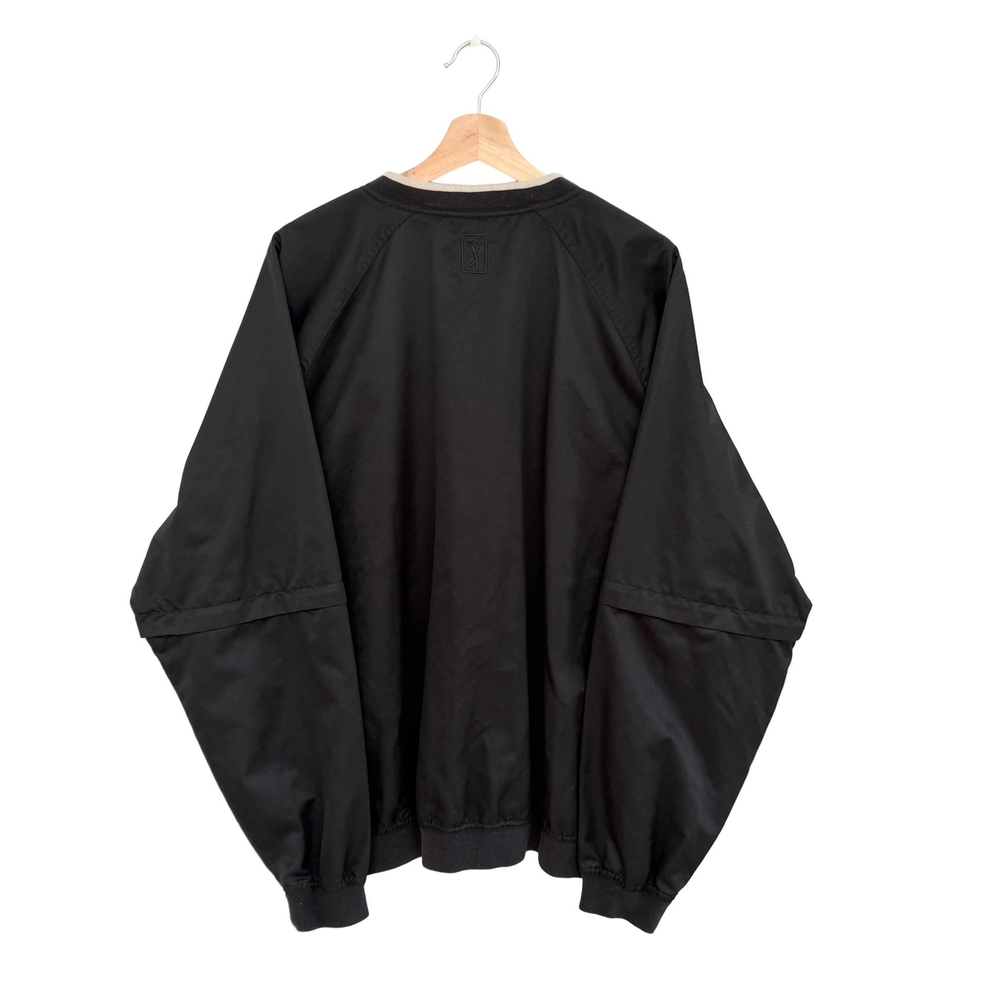 Black jacket on a hanger against a white background