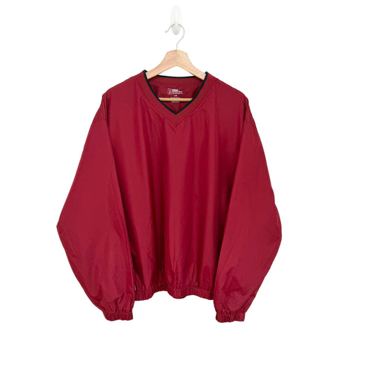 Red windbreaker on a hanger against a white background