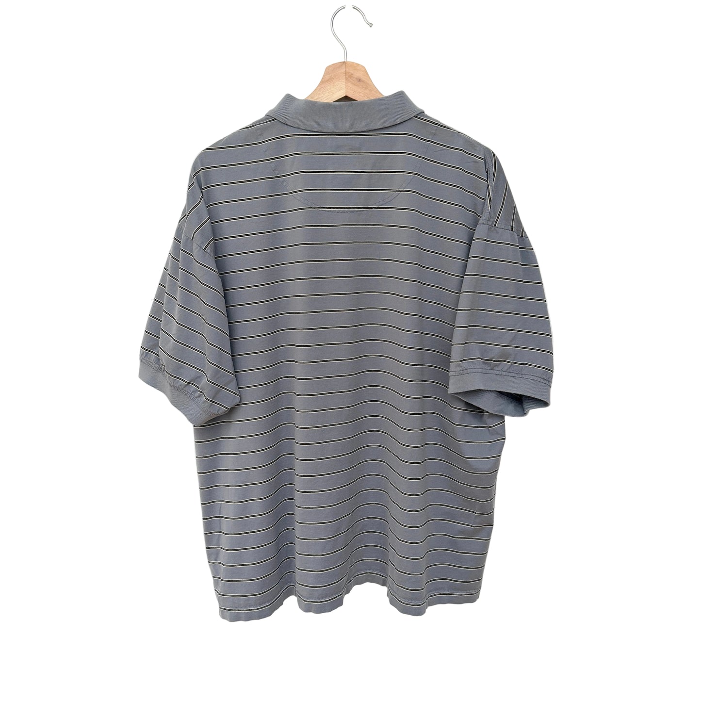 Gray striped shirt on a hanger against a white background