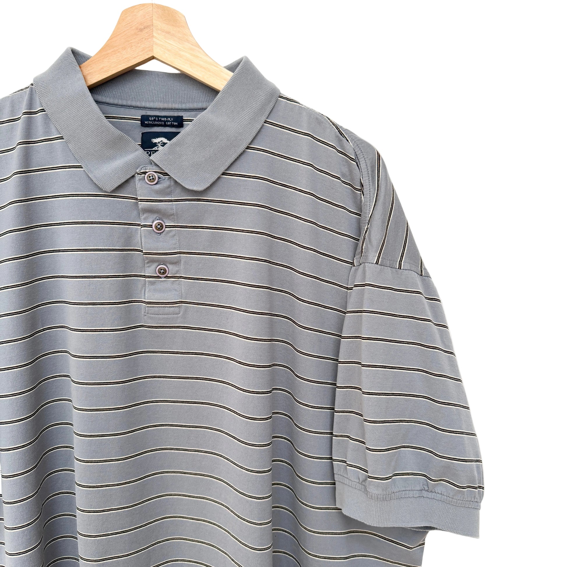 Gray striped polo shirt on a wooden hanger against a white background