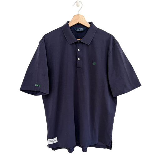 Navy blue polo shirt on a hanger against a white background