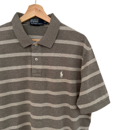 Tan striped polo shirt with Polo Ralph Lauren logo on a hanger against a white background