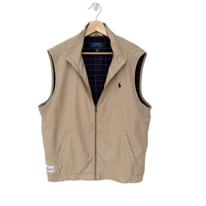 Beige vest with a brand logo on a white background