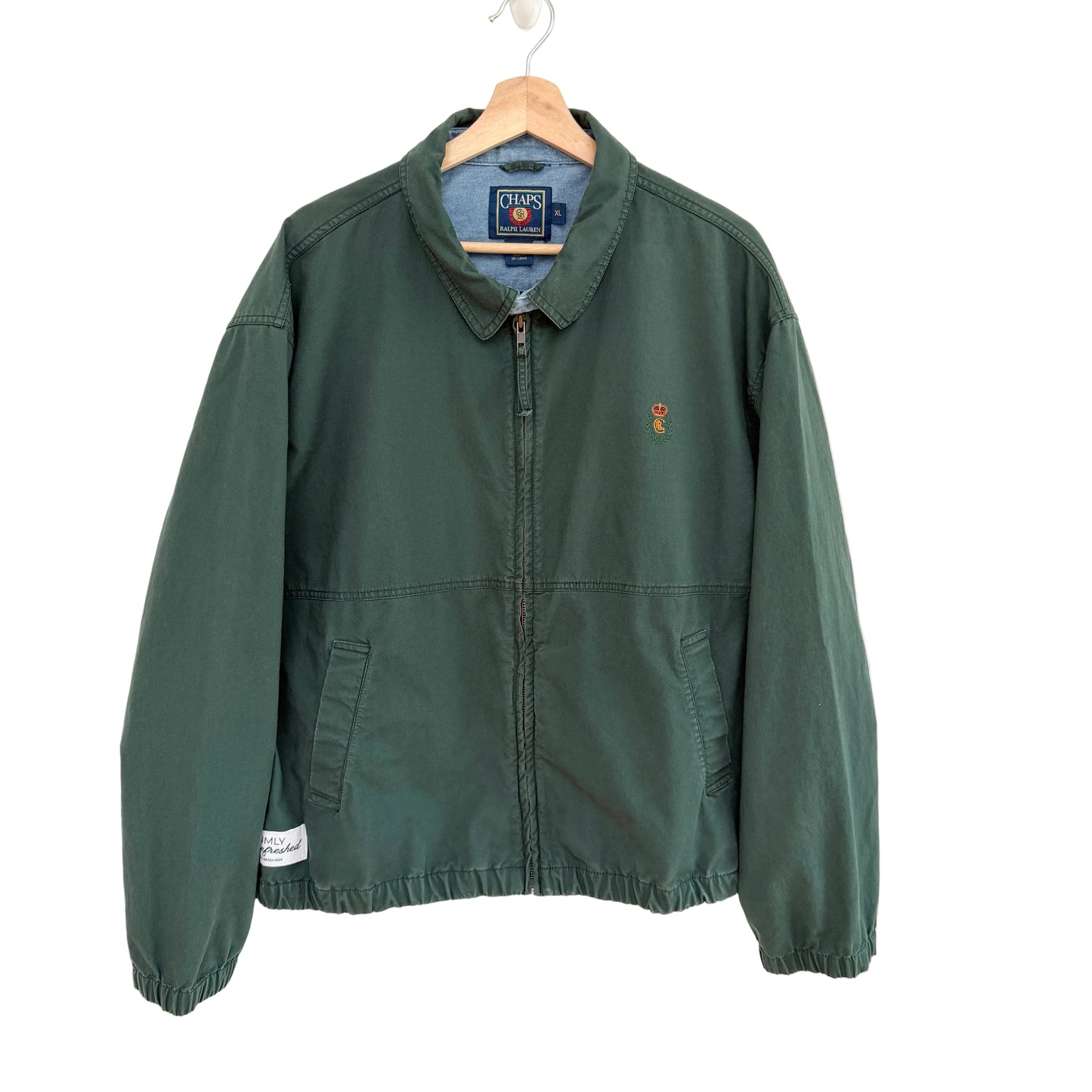 Green jacket with a brand logo on a white background