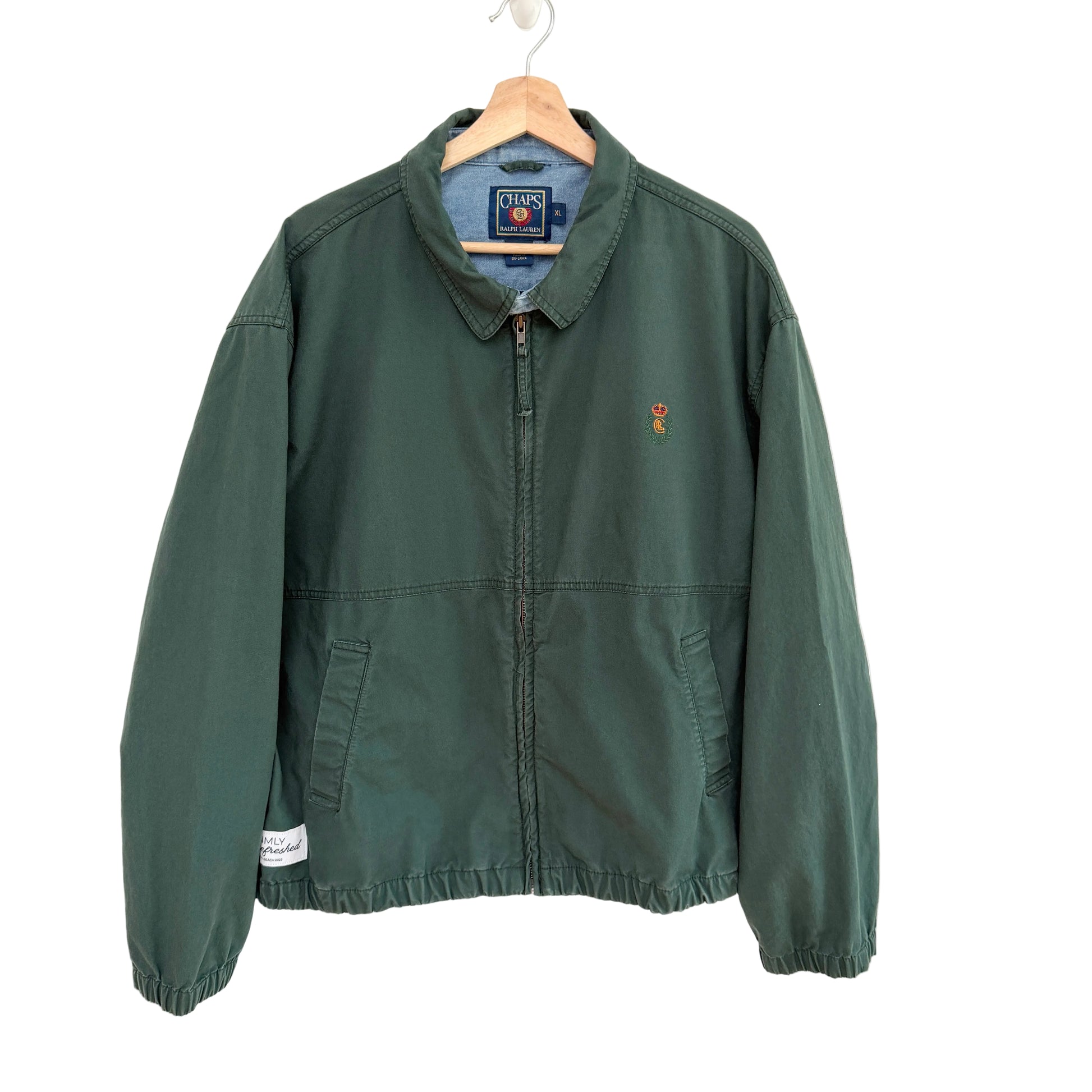 Green jacket with a brand logo on a white background